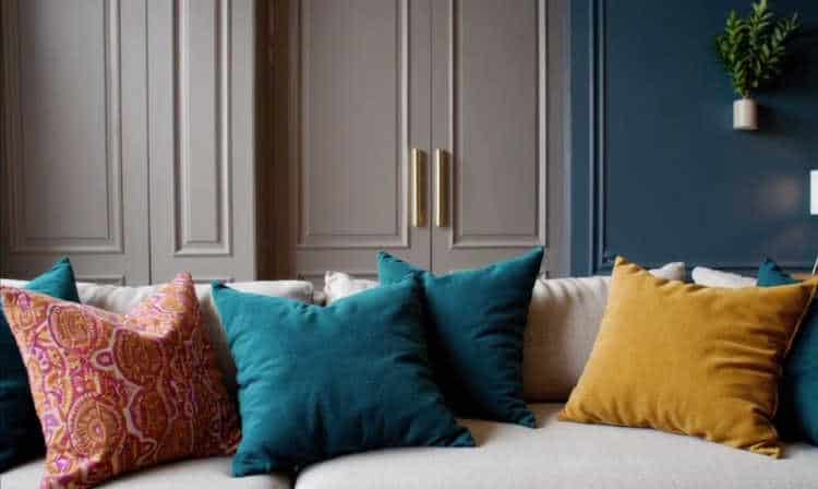 Home interior with updated hardware, vibrant throw pillows, and trendy paint colors.