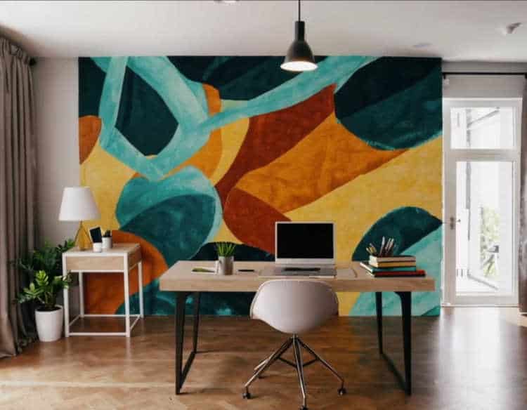 A hand-painted artistic mural featuring abstract shapes in a modern home office.