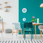 Stylish green apartment interior showcasing 2025's top paint trends like earthy tones and bold accents.