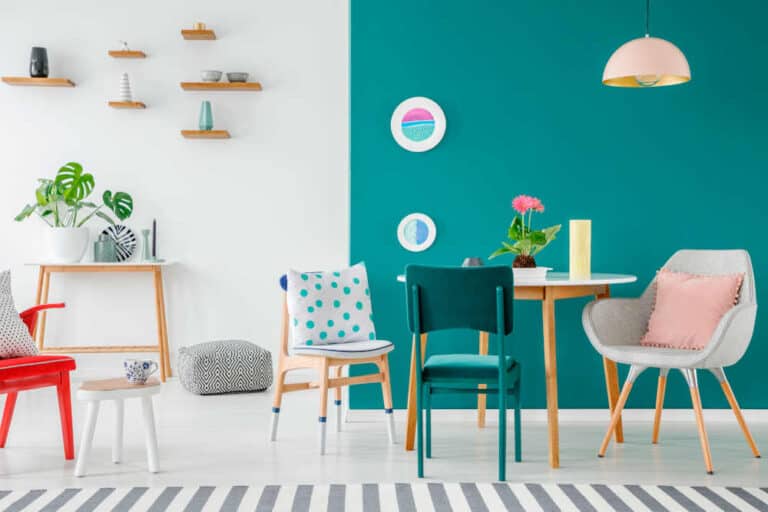 Stylish green apartment interior showcasing 2025's top paint trends like earthy tones and bold accents.