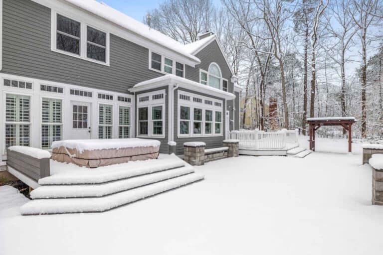 A beautifully painted grey house in Cleveland, Ohio, surrounded by snow in winter.