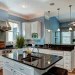 Beautiful kitchen with light blue cabinets and modern decor, showcasing 2025 design trends.