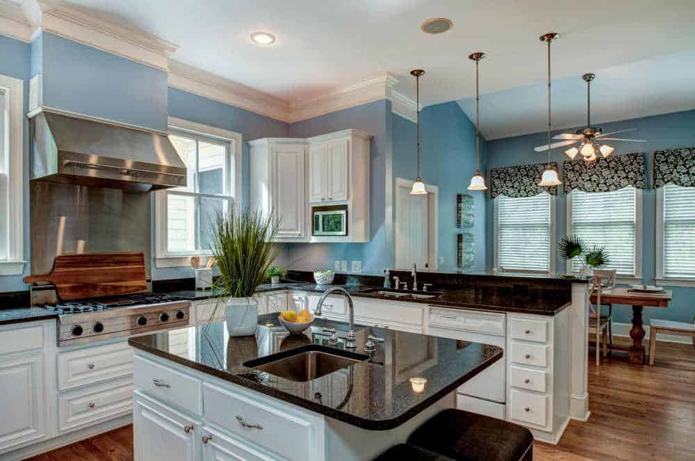 Beautiful kitchen with light blue cabinets and modern decor, showcasing 2025 design trends.