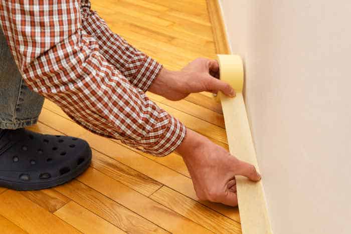 Close-up of painters tape applied on a clean surface for painting preparation.