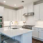 Modern Ohio kitchen with freshly painted white cabinets and stainless appliances