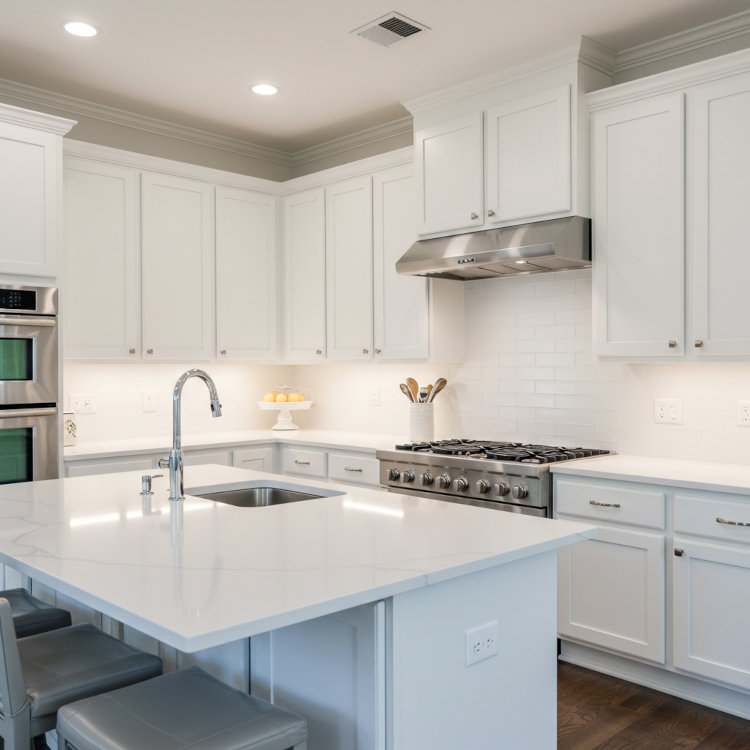 Modern Ohio kitchen with freshly painted white cabinets and stainless appliances