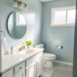 Small Ohio bathroom with light reflective wall paint enhancing brightness and space.