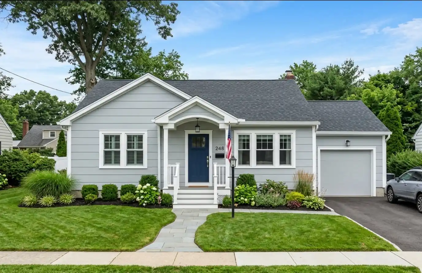 single story home with restored aluminum siding and white trim, an example of aluminum siding refinishing costs