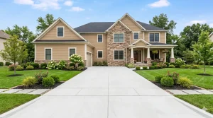 Light gray concrete driveway leading up to a home in Ohio