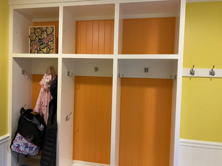 Built-in mudroom lockers with painted white trim