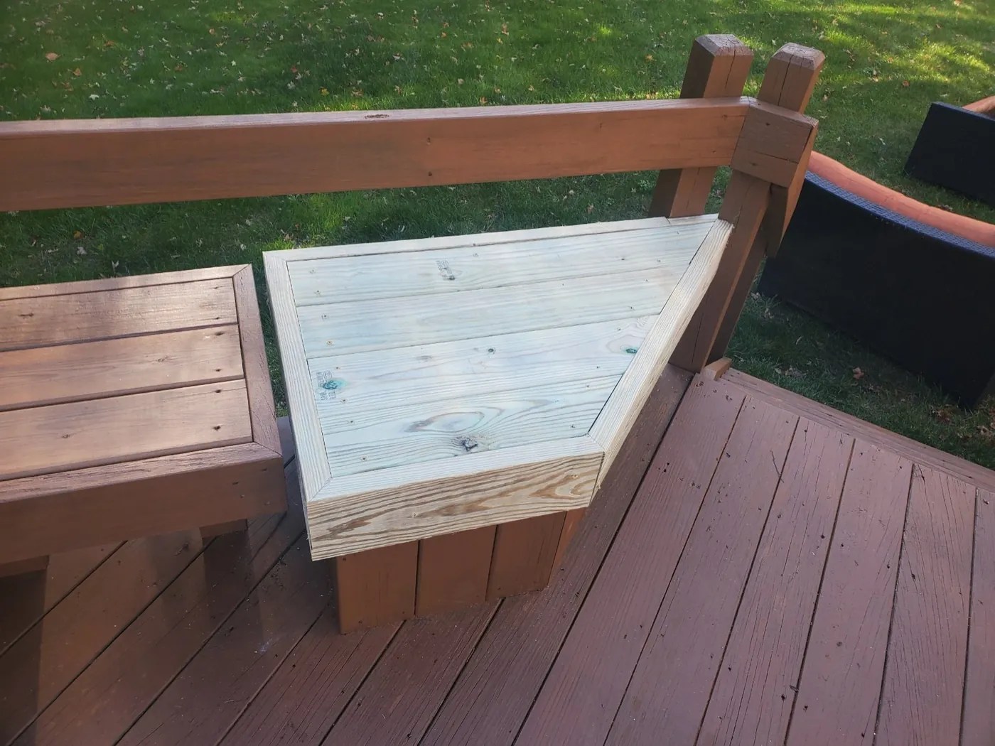 Close-up of a freshly stained deck bench and railing corner by Crocker Home Painting in Westlake, Ohio