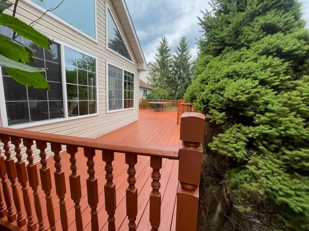 Freshly stained gazebo and backyard deck with a paint bucket, deck staining by Crocker Home Painting in Westlake, Ohio